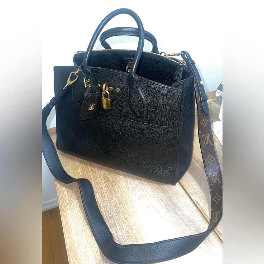 Black leather , gold lock Louis Vuitton Purse